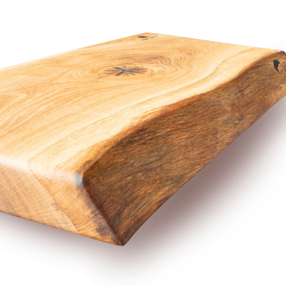 Handcrafted wooden chopping board with natural live edge